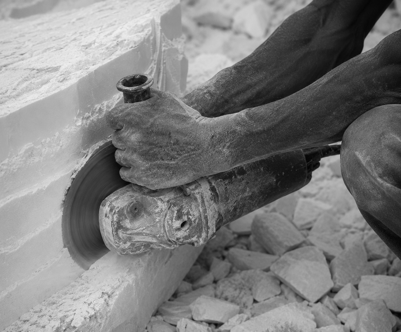 Artisan crafting marble by hand